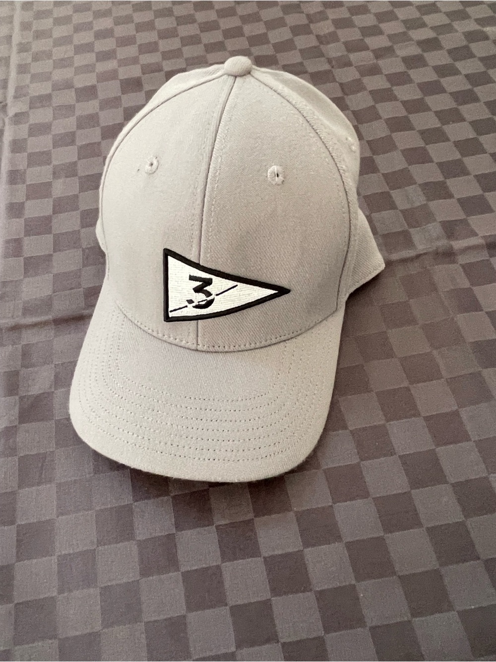 Grey number three cap